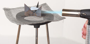 Torch firing enameled metal